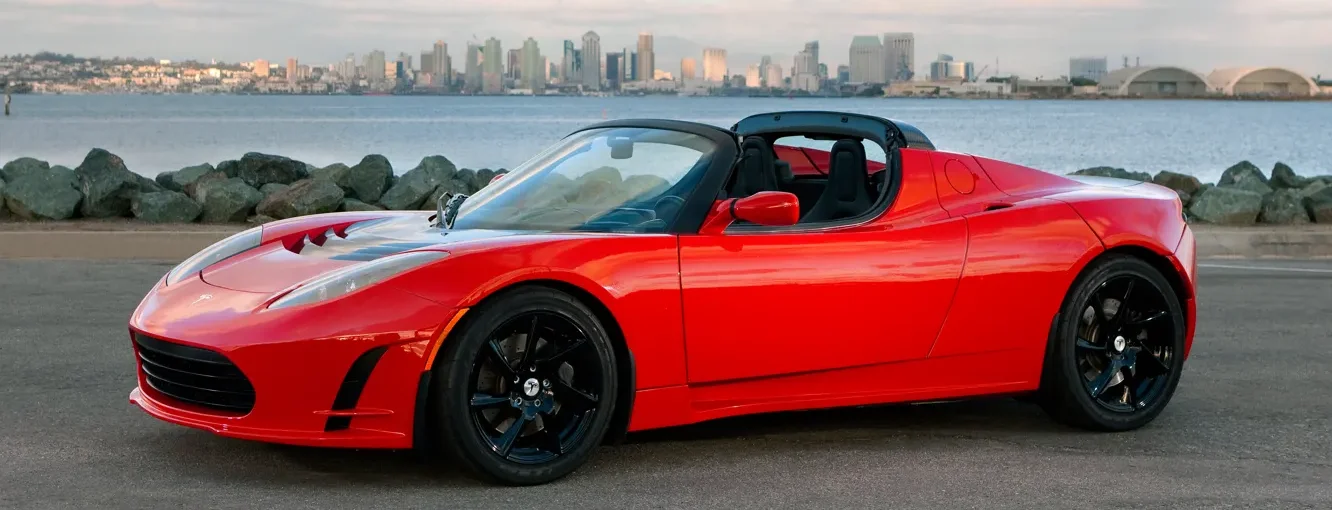A red Tesla Roadster sports car